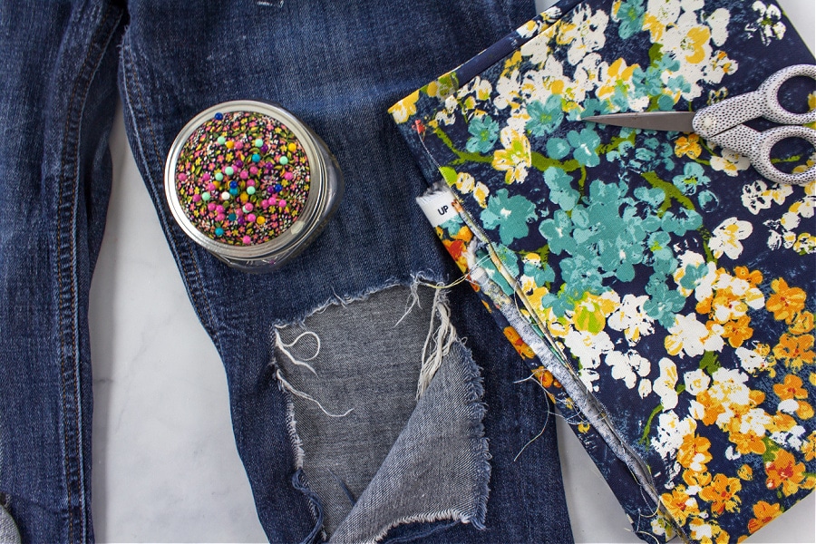 One of the best fabrics to patch holes in denim jeans is canvas. This one has flowers on it.