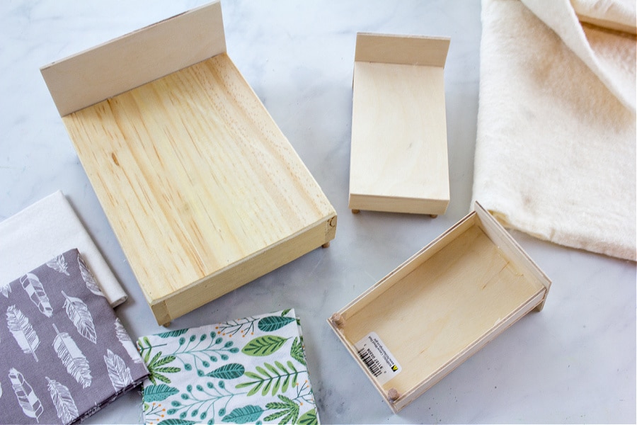 DIY plywood dollhouse bed with a headboard