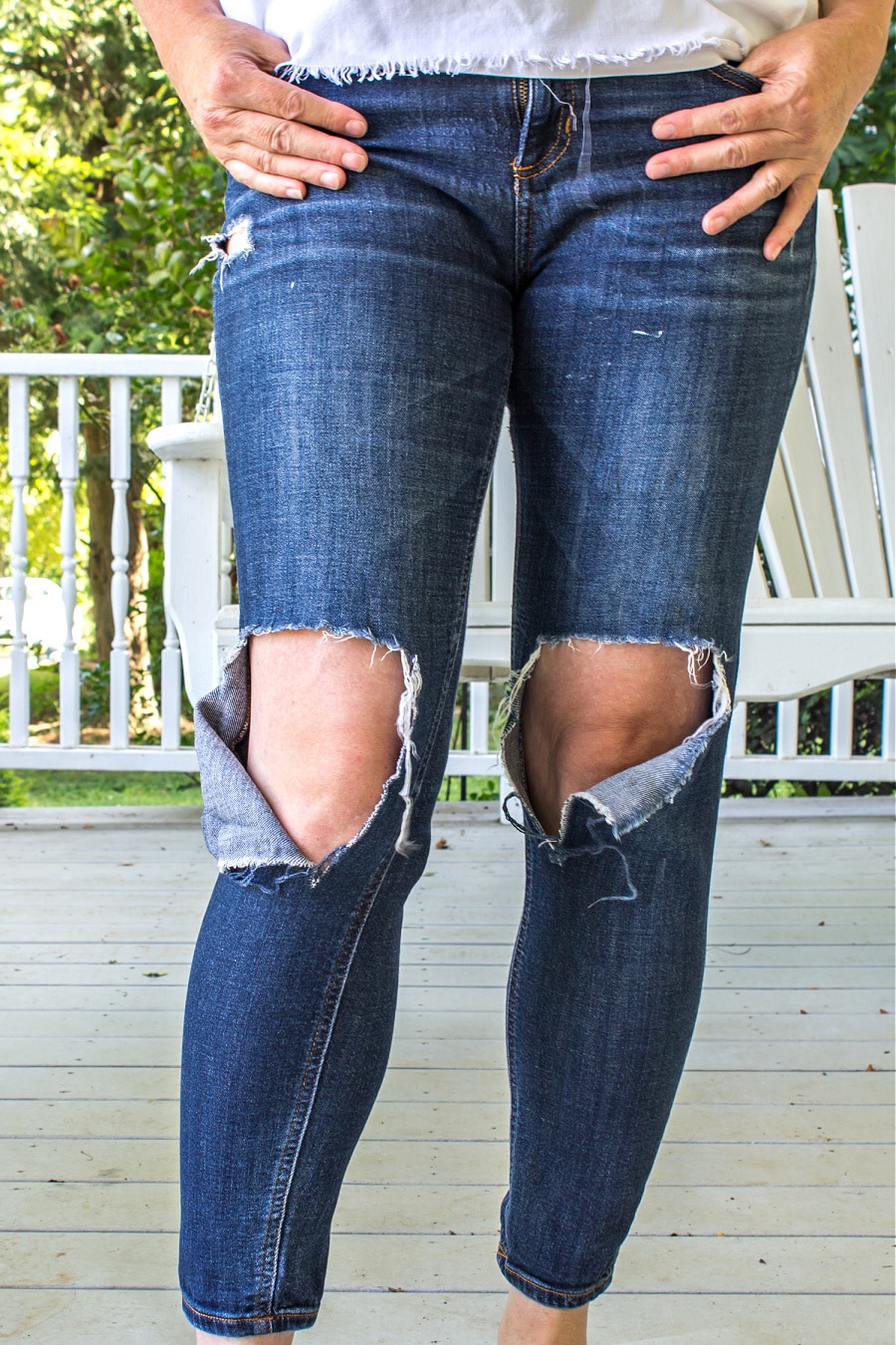 Jeans with knee holes that have stretched and split that need to be patched.