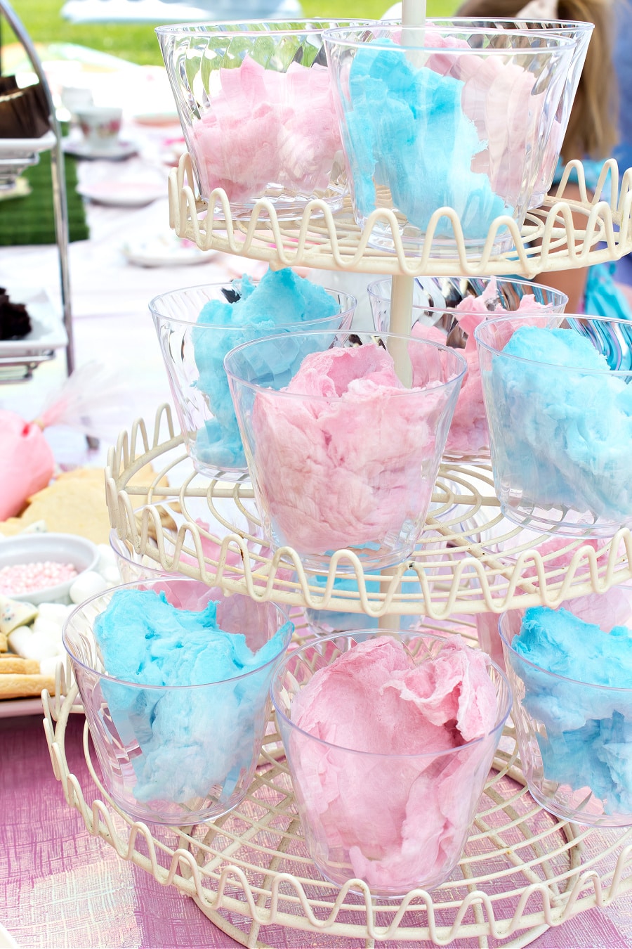 Serve cotton candy at your party in individual plastic cups and put them on a tiered food stand.