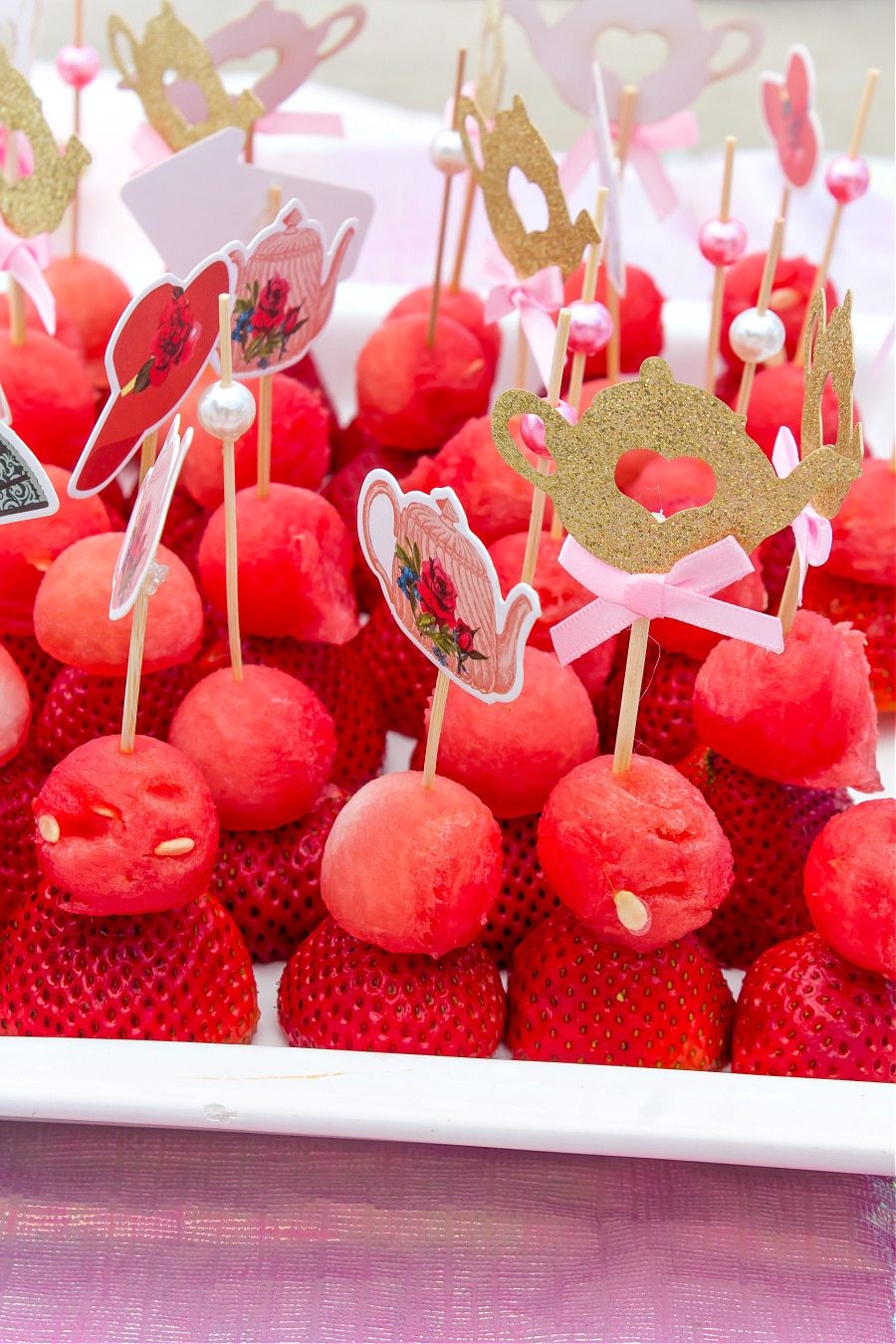 Healthy fruit party picks with watermelon balls and strawberries for a tea party.