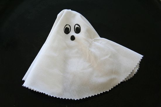 a hand puppet ghost made out of a sock and fabric