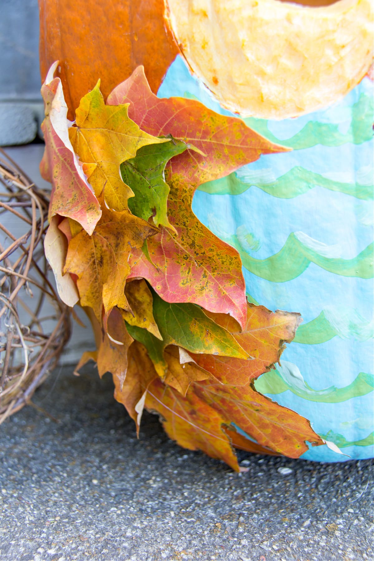 Attach fall leaves to the sides of your pumpkin to make owl wings