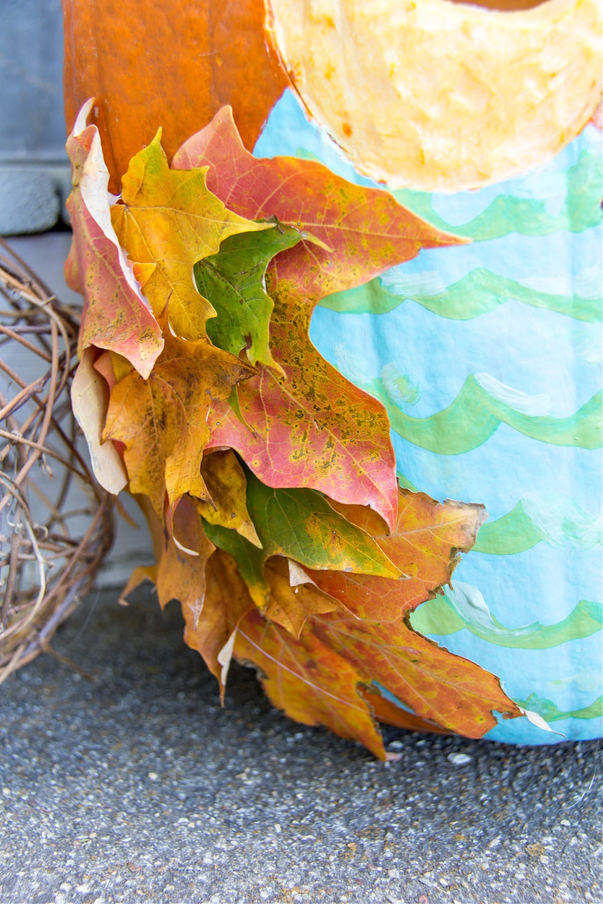 Attach fall leaves to the sides of your pumpkin to make owl wings