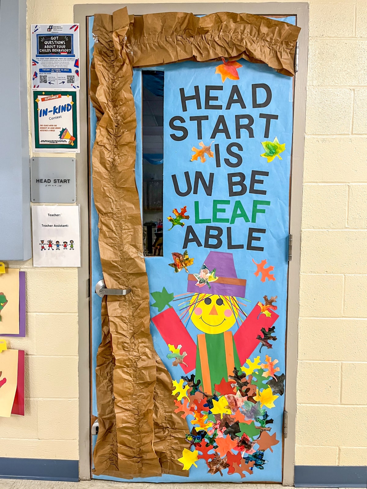 Fall classroom door ideas including a construction paper scarecrow, packaging paper repurposed into a tree, and watercolor fall leaves painted by kids.