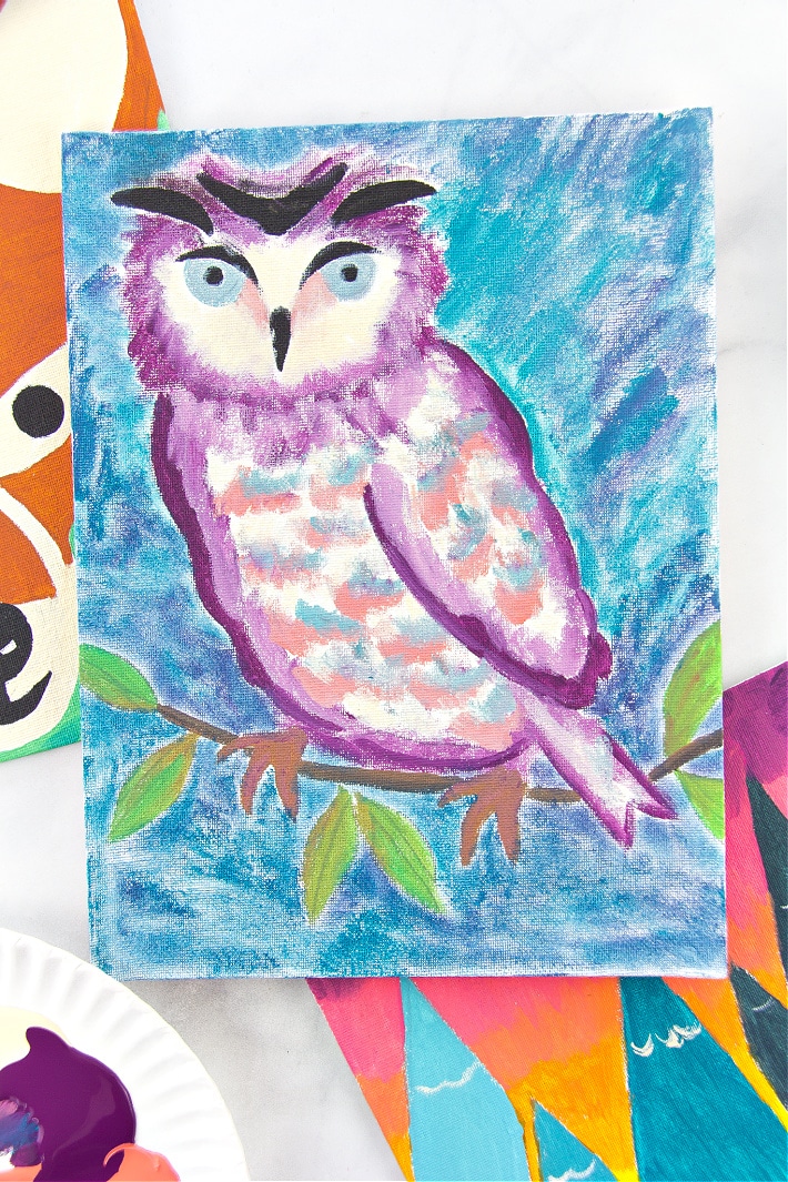 a painting of an owl made by using a stencil and paints on a canvas