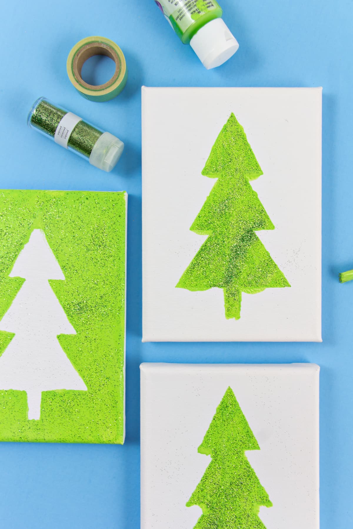 Christmas tree art on canvas for kids using stencils and tape