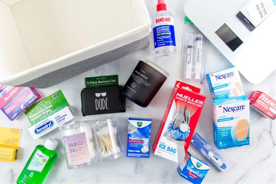 a gift hamper for adult children that contains medicine cabinet items, thermometer, bandaids, and more
