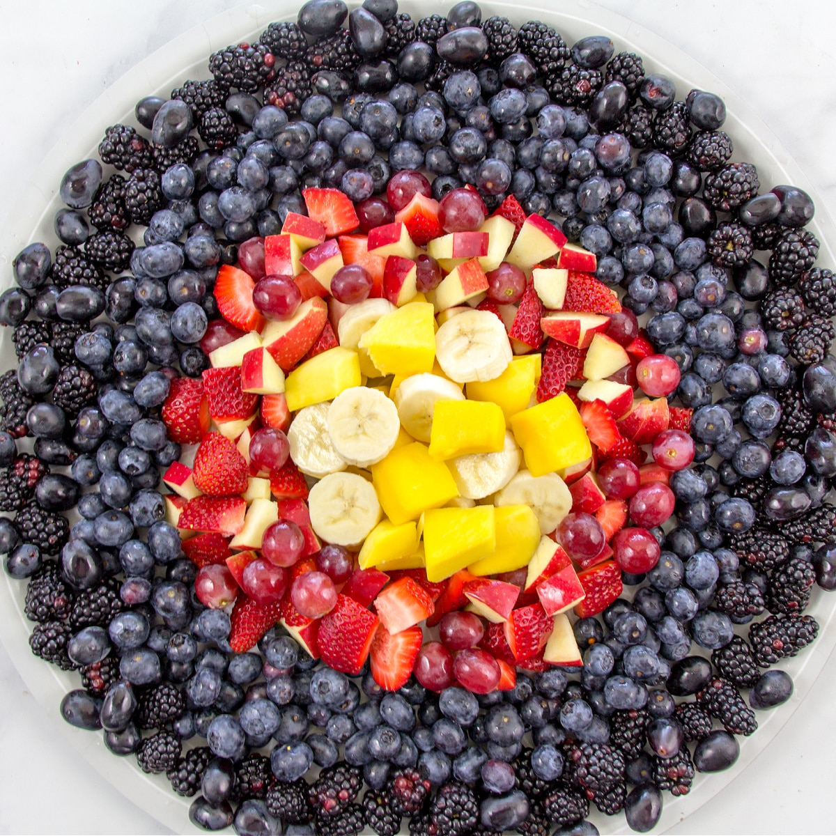 a fruit tray that looks like a bullseye target for an archery party