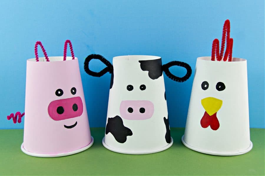 paper cup farm animals craft including a pig, cow, and rooster