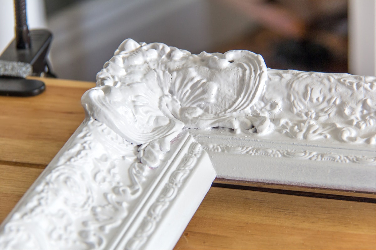 A missing piece of a mirror frame was replaced using a mold and Plaster of Paris