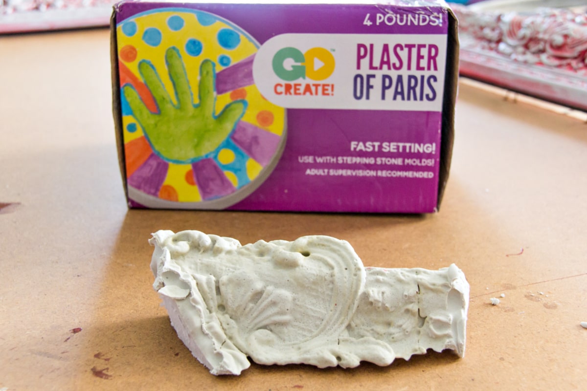 Plaster of Paris used to repair a broken mirror frame.