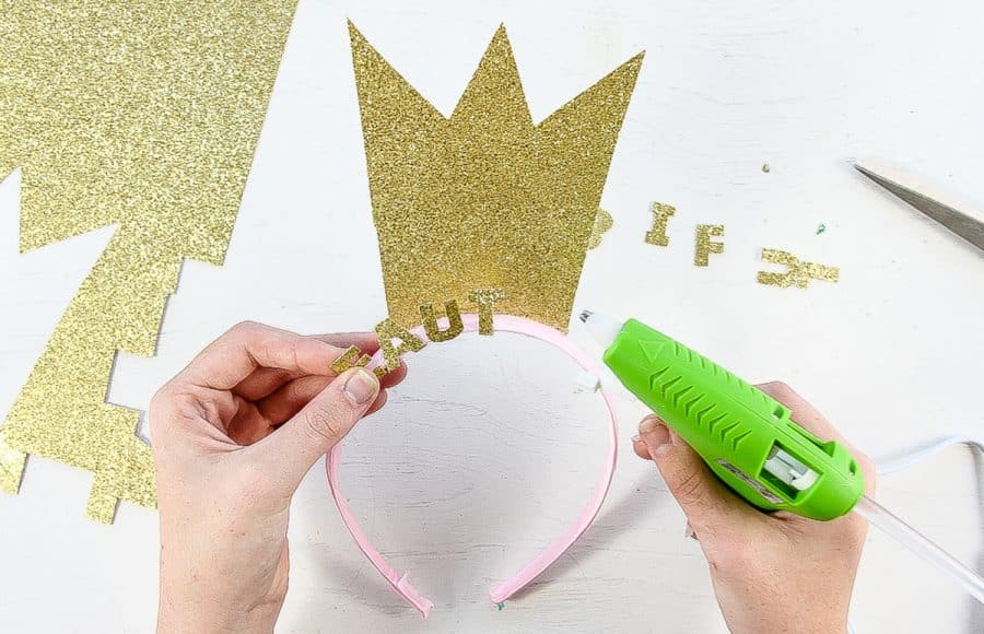 a sparkly crown being made out of glitter card stock for a fancy nancy costume