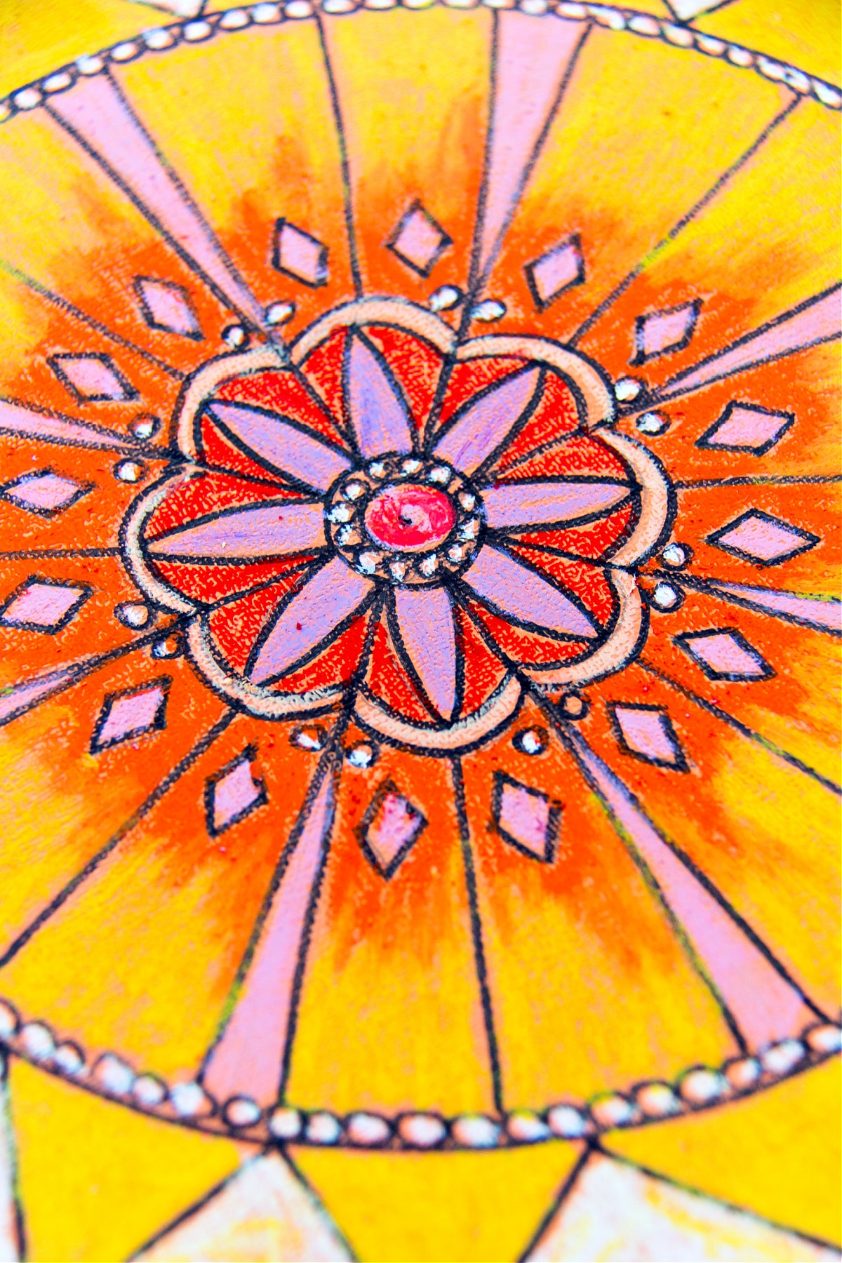 blended oil pastel colors together when coloring in your sun mandala