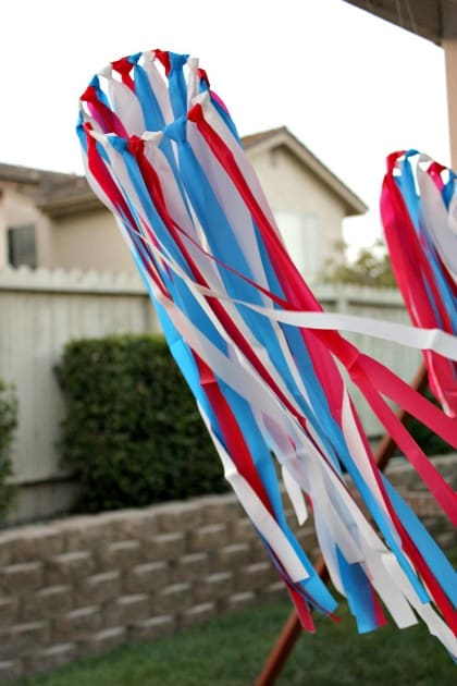 a red white and blue windsock made using plastic tablecloths