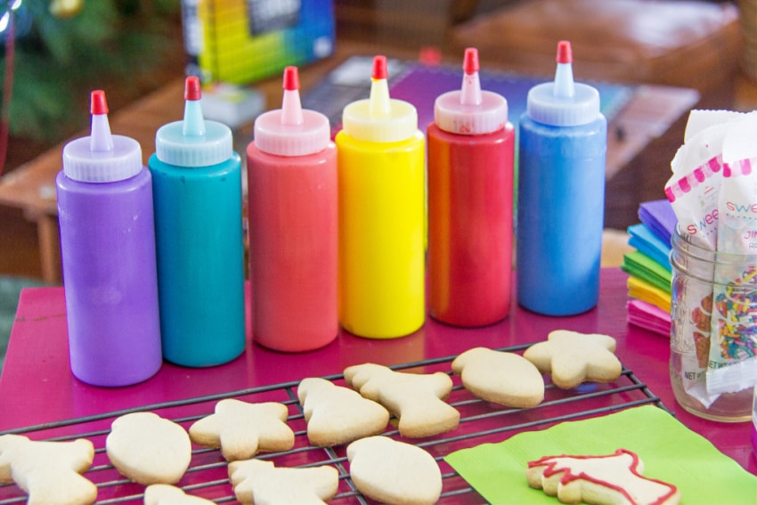 colorful flood icing in squeeze bottles for decorating christmas cookies