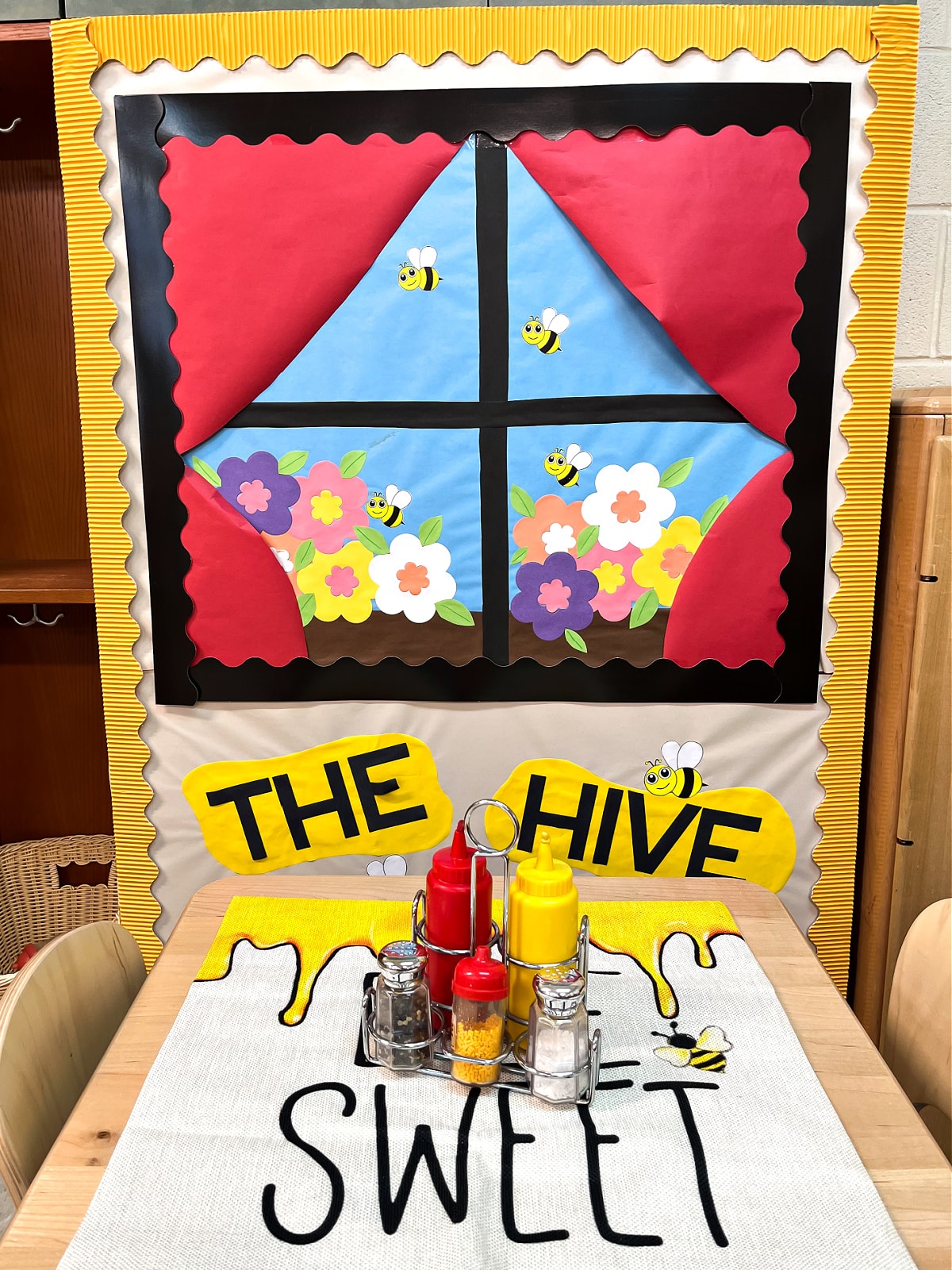 the hive preschool classroom home center cafe with decorations and menus.