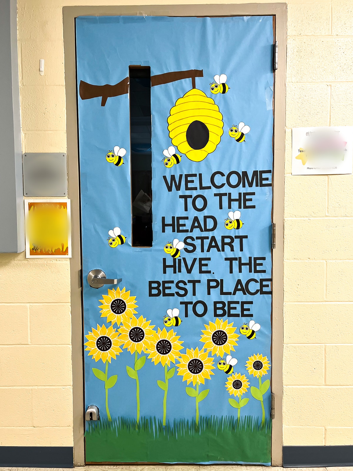 a bee theme classroom door with sunflowers a beehive and bees