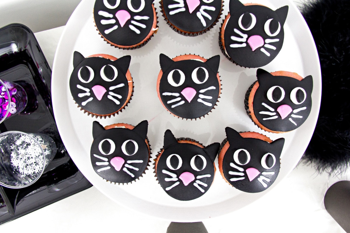 black cat cupcakes for a black cat day themed halloween party