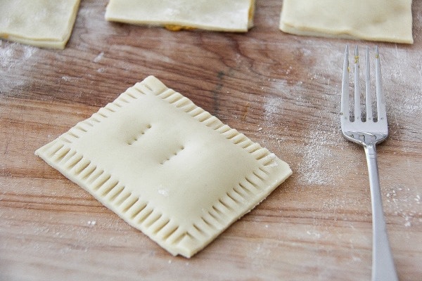 a homemade pop tart with a fork used to pinch the edges together.