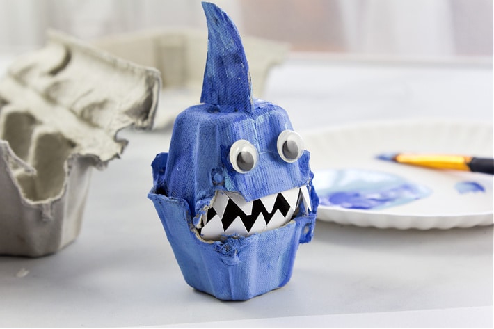 a shark made out of an egg carton and recycled cardboard